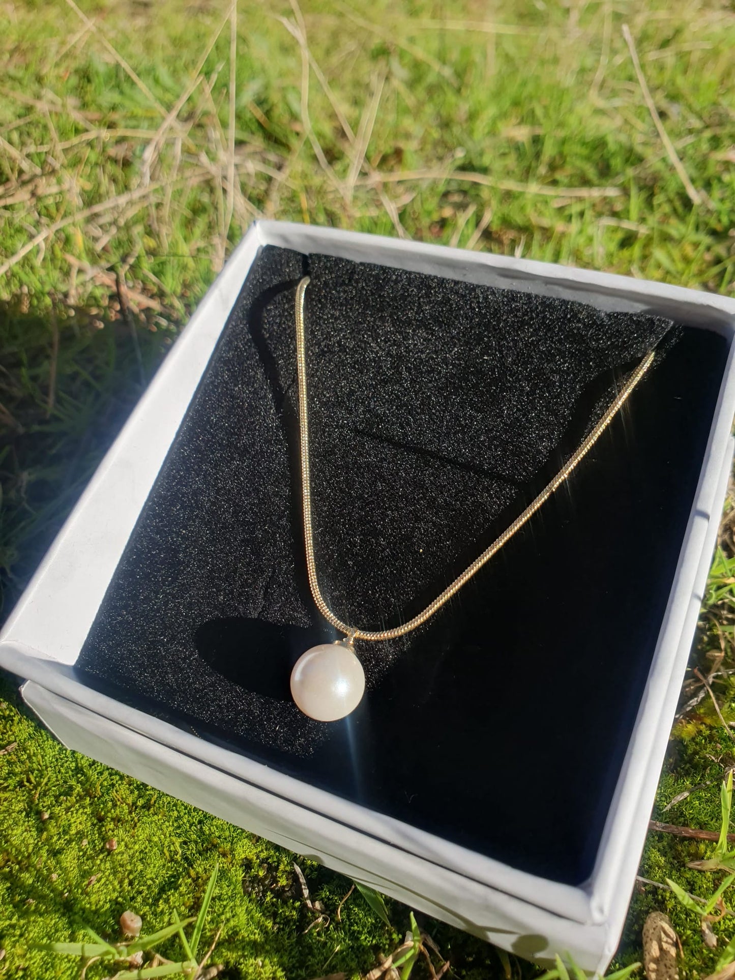 Collar elegante con perla